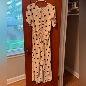 Polka dot dress. Cream with black dots - worn twice - high low cut